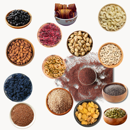 Assorted nuts, seeds, and dried fruits in small bowls on a white background